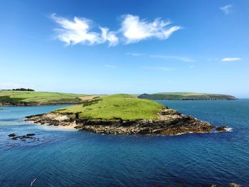 Scenic view of sea against blue sky