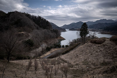 Scenic view of landscape and mountains against sky