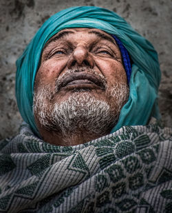 Close-up portrait of man wearing mask