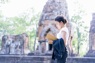 Tourists or archaeologists are exploring the once prosperous khmer castle.