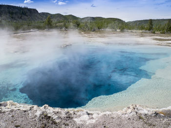 View of hot spring against sky