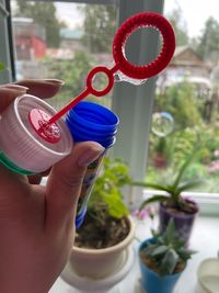 Hand of woman holding bubble wand