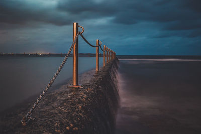 Pier over sea against sky