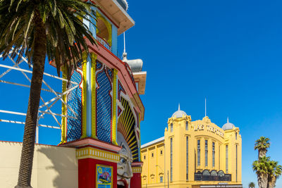 Low angle view of building against blue sky