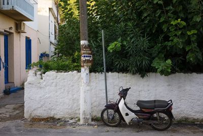 Motor scooter parked on footpath