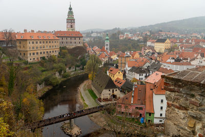 High angle view of river amidst buildings in city