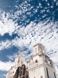 Low angle view of building against cloudy sky
