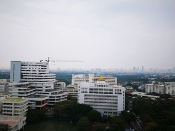 Buildings in city against sky