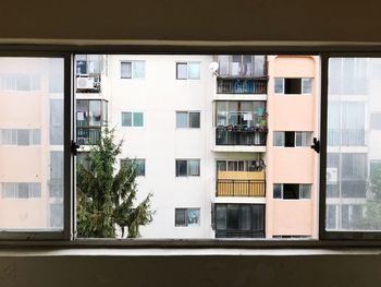 Residential building seen through window