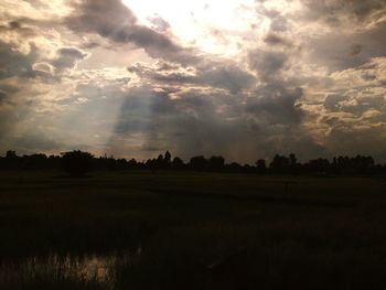 Scenic view of field against sky during sunset