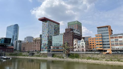 Buildings in city against sky