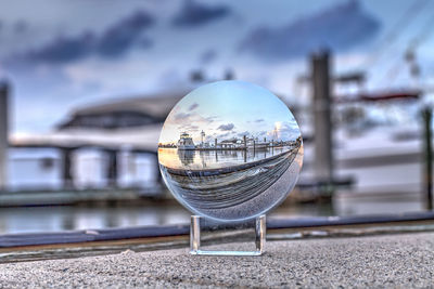 Bright crystal ball view of sunset over the boats in esplanade harbor marina in marco island, florid