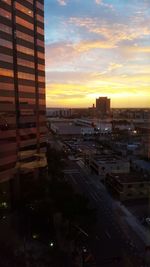 Cityscape against sky during sunset