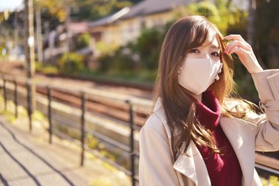 Portrait of woman standing outdoors