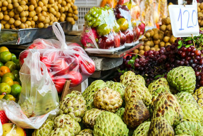 Various fruits for sale at market stall