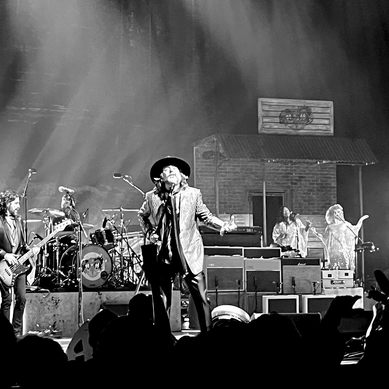 black and white, music, arts culture and entertainment, performance, musician, monochrome, concert, monochrome photography, black, event, stage, rock concert, musical instrument, entertainment, crowd, popular music concert, men, occupation, adult, performing arts event, rock music, live event, musical equipment, group of people, music festival, person, input device, microphone, singing, drummer, singer