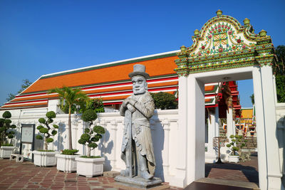 Chinese guardian statue in wat pho buddhist temple, old city of bangkok, thailand