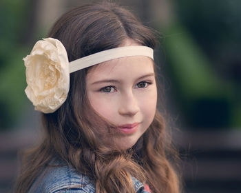 Close-up of happy girl looking away while wearing headband