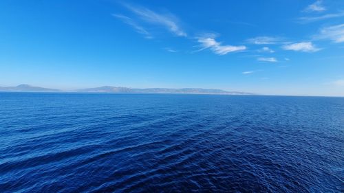 Scenic view of sea against blue sky