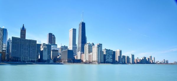 View of skyscrapers against blue sky