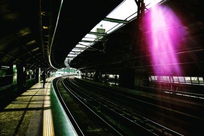 Train at railroad station at night