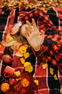 Life style portrait of happy woman in fall park. beautiful girl on the nature picnic camping. 