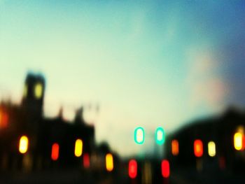 Defocused image of illuminated city at night