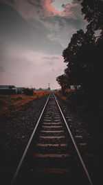 Surface level of railroad tracks against sky