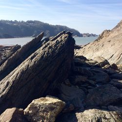 Rock formations on landscape against sky