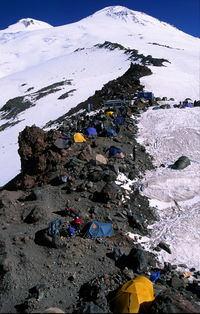 Close-up of snow on mountain against sky