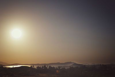 Scenic view of landscape against sky during sunset