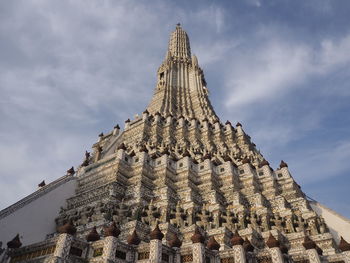 Low angle view of temple building against cloudy sky