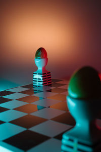 Close-up of chess pieces on table