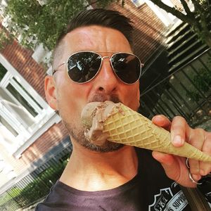 Portrait of man holding ice cream