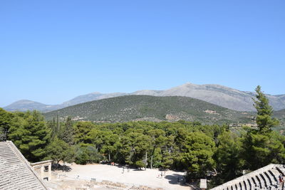 Scenic view of mountains against clear blue sky