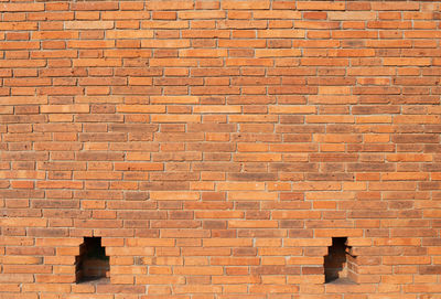 Low angle view of brick wall