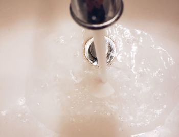 High angle view of water splashing in container