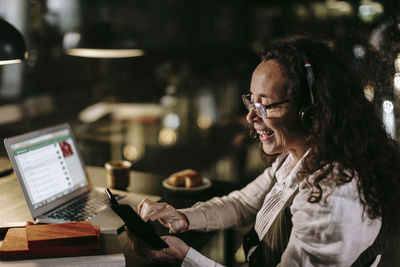 Woman in office at night