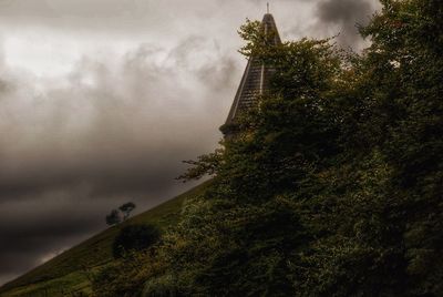 Scenic view of mountains against cloudy sky