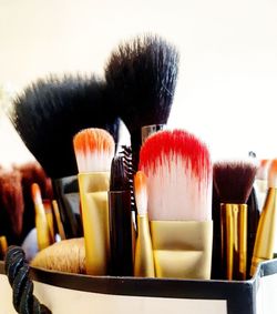 Close-up of paintbrushes in container