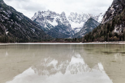 Reflection of trees in lake against sky