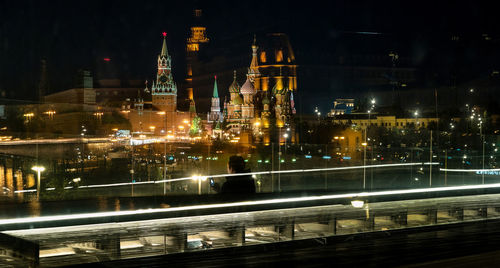 Illuminated city buildings at night