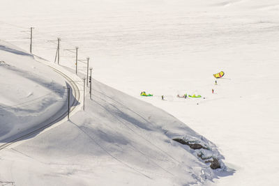 Aerial view of people on snow covered landscape