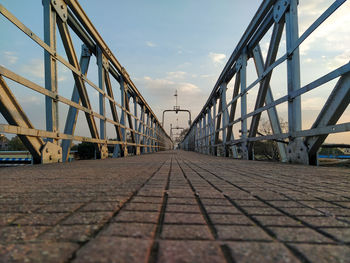 Surface level of bridge against sky