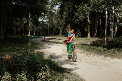 Man riding bicycle on road