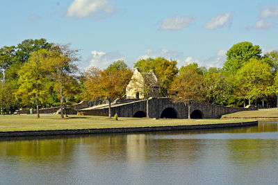 View of small bridge over calm lake