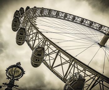 Low angle view of ferris wheel against sky