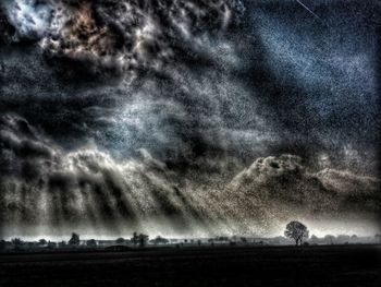 Storm clouds over field