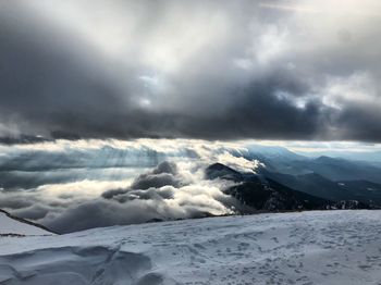 Scenic view of snowcapped mountains against sky