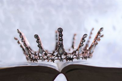 Close-up of hand on book